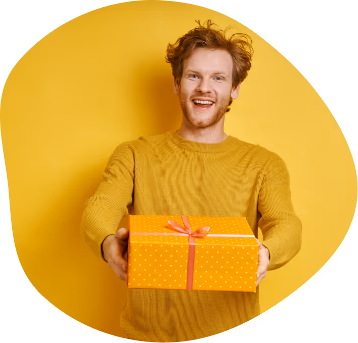 A happy man holding a gift box