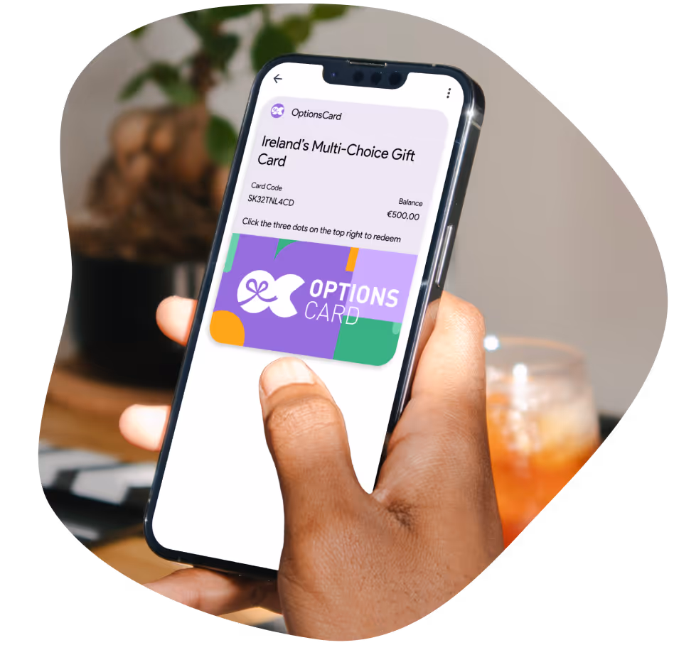 Person holding their phone with an OptionsCard in their digital wallet