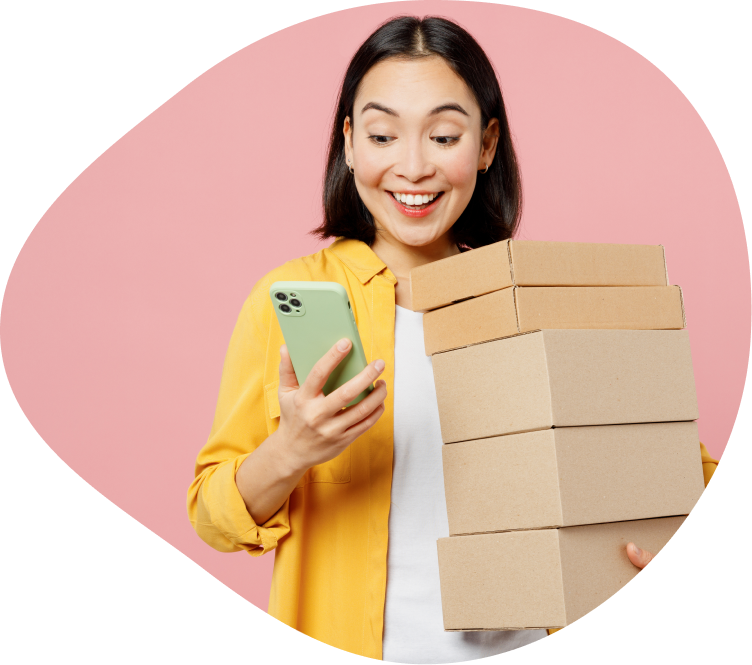 Happy woman with a phone and gift boxes